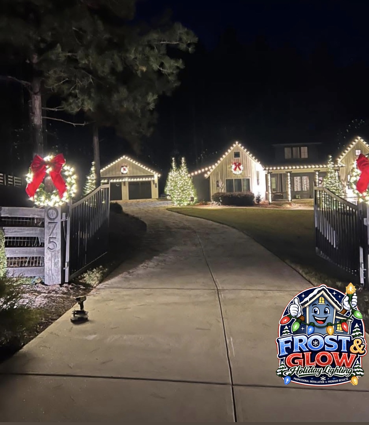 Warm-white estate entrance with holiday wreaths